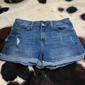 Just black denim shorts.